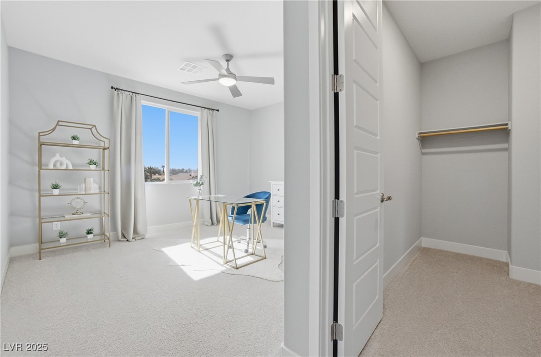 7736 Tioga Ridge Las Vegas, NV 89117 - Photo 40 of 68 Bedroom featuring light carpet and a ceiling fan