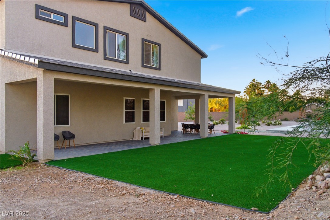 7736 Tioga Ridge Las Vegas, NV 89117 - Photo 55 of 68 Rear view of property featuring a patio and stucco siding
