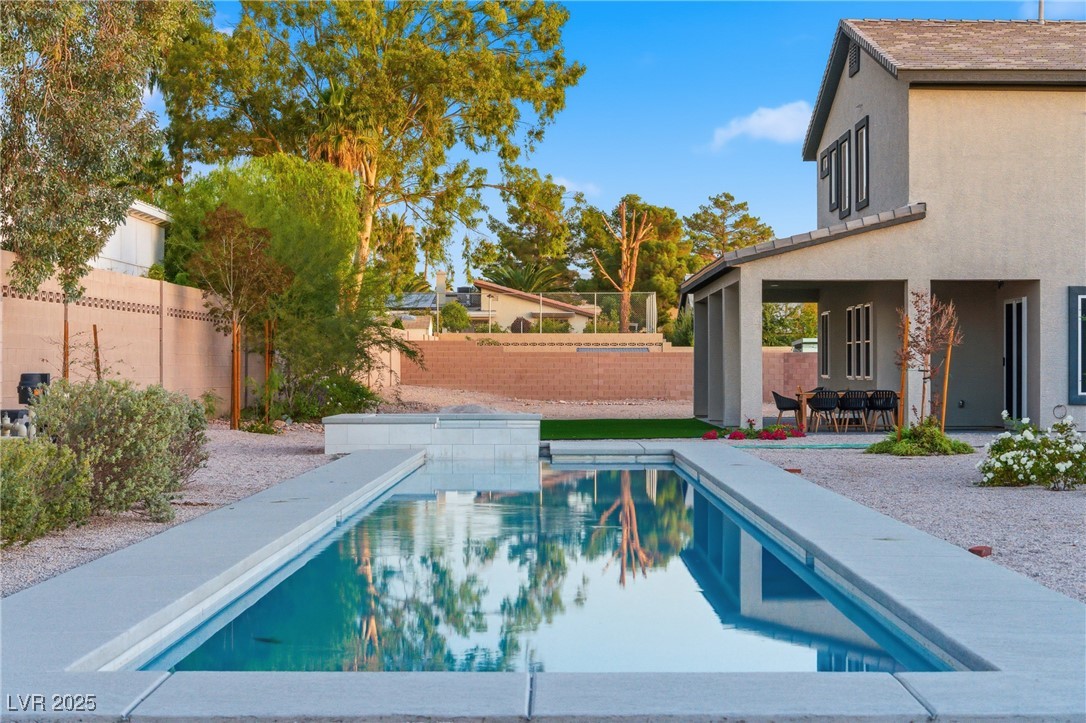 7736 Tioga Ridge Las Vegas, NV 89117 - Photo 56 of 68 View of swimming pool with a patio and a fenced backyard