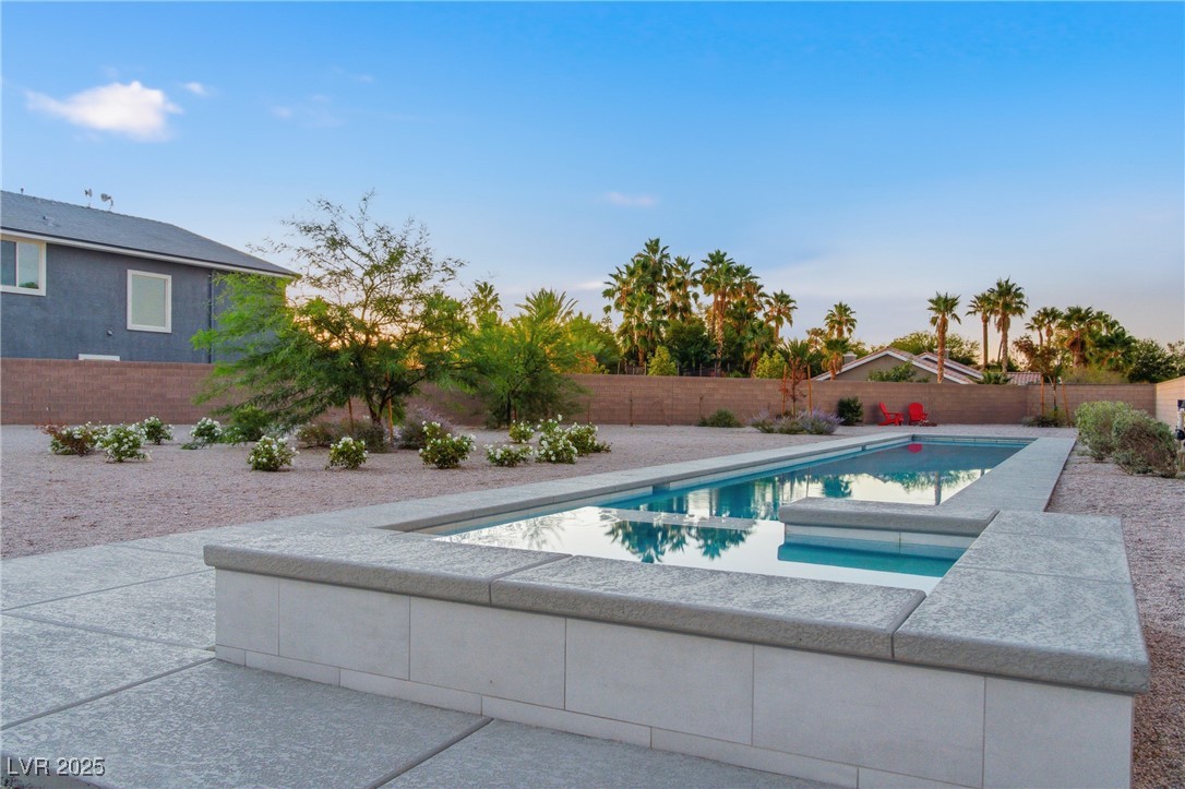 7736 Tioga Ridge Las Vegas, NV 89117 - Photo 60 of 68 View of pool featuring a fenced backyard and a patio
