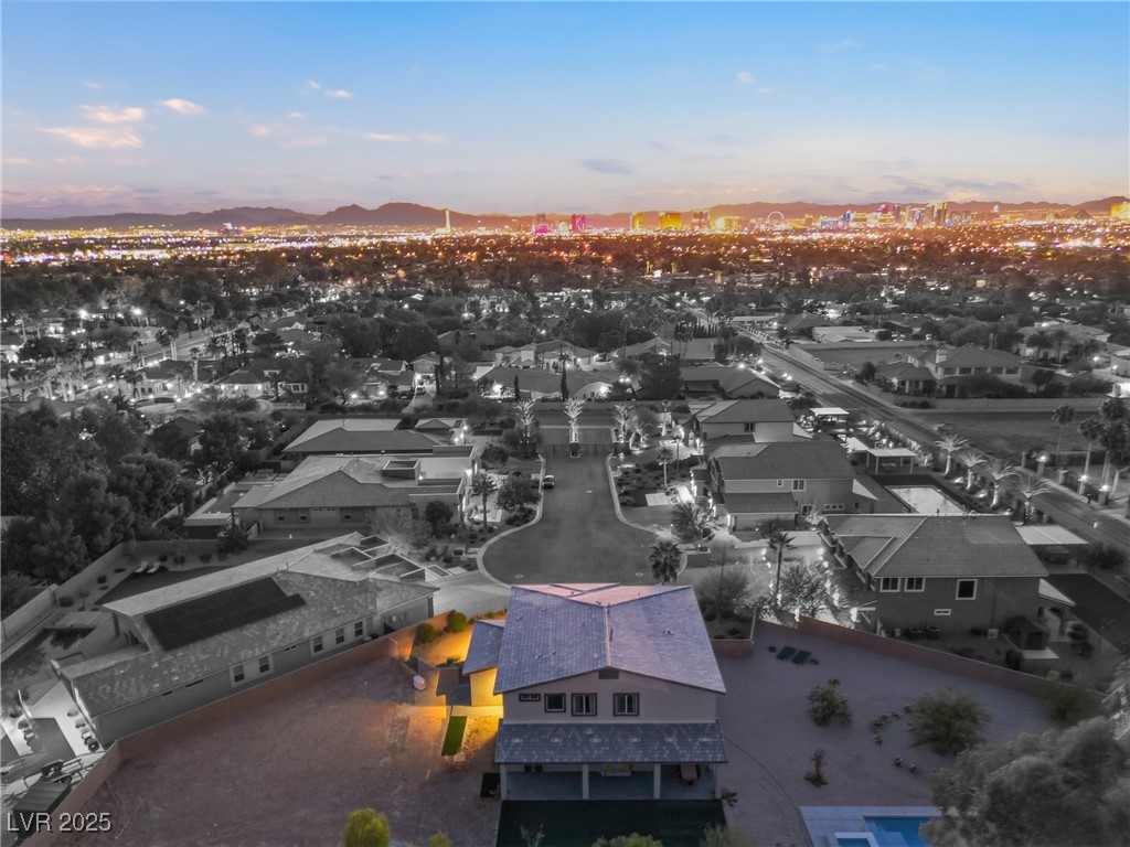 7736 Tioga Ridge Las Vegas, NV 89117 - Photo 65 of 68 Aerial view at dusk of a mountain view and a residential view