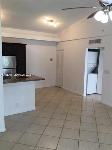 951 Lyons Road, Unit 6206 Coconut Creek, FL 33063 - Photo 5 of 27 a view of a kitchen with a sink and cabinets