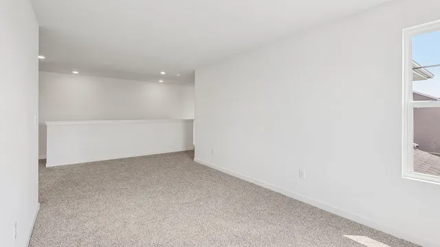 a view of an empty room and closet