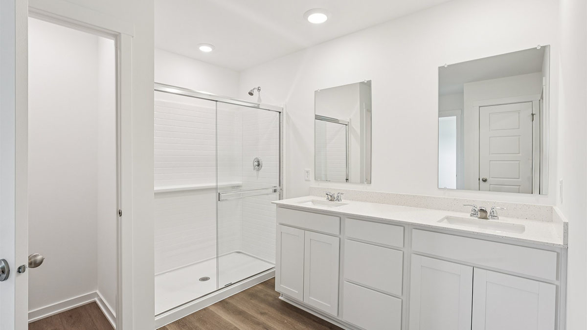 2516 Winterberry Trail Wonder Lake, IL 60097 - Photo 20 of 68 a bathroom with a double vanity sink and mirror