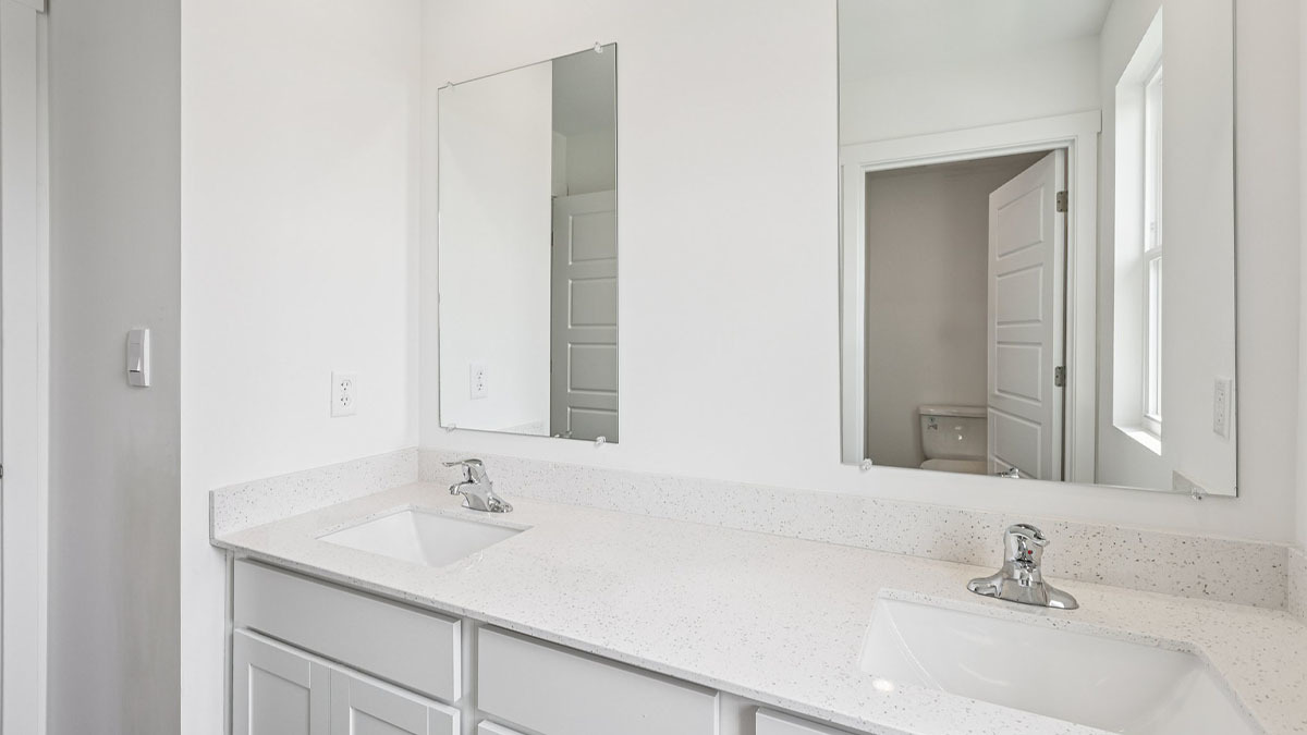 2516 Winterberry Trail Wonder Lake, IL 60097 - Photo 27 of 68 a bathroom with a sink and a mirror
