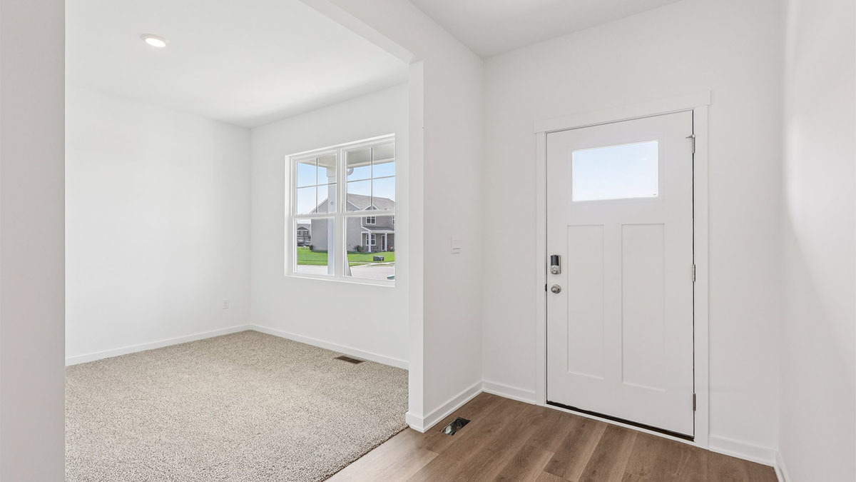 2516 Winterberry Trail Wonder Lake, IL 60097 - Photo 3 of 68 an empty room with a window and wooden floor