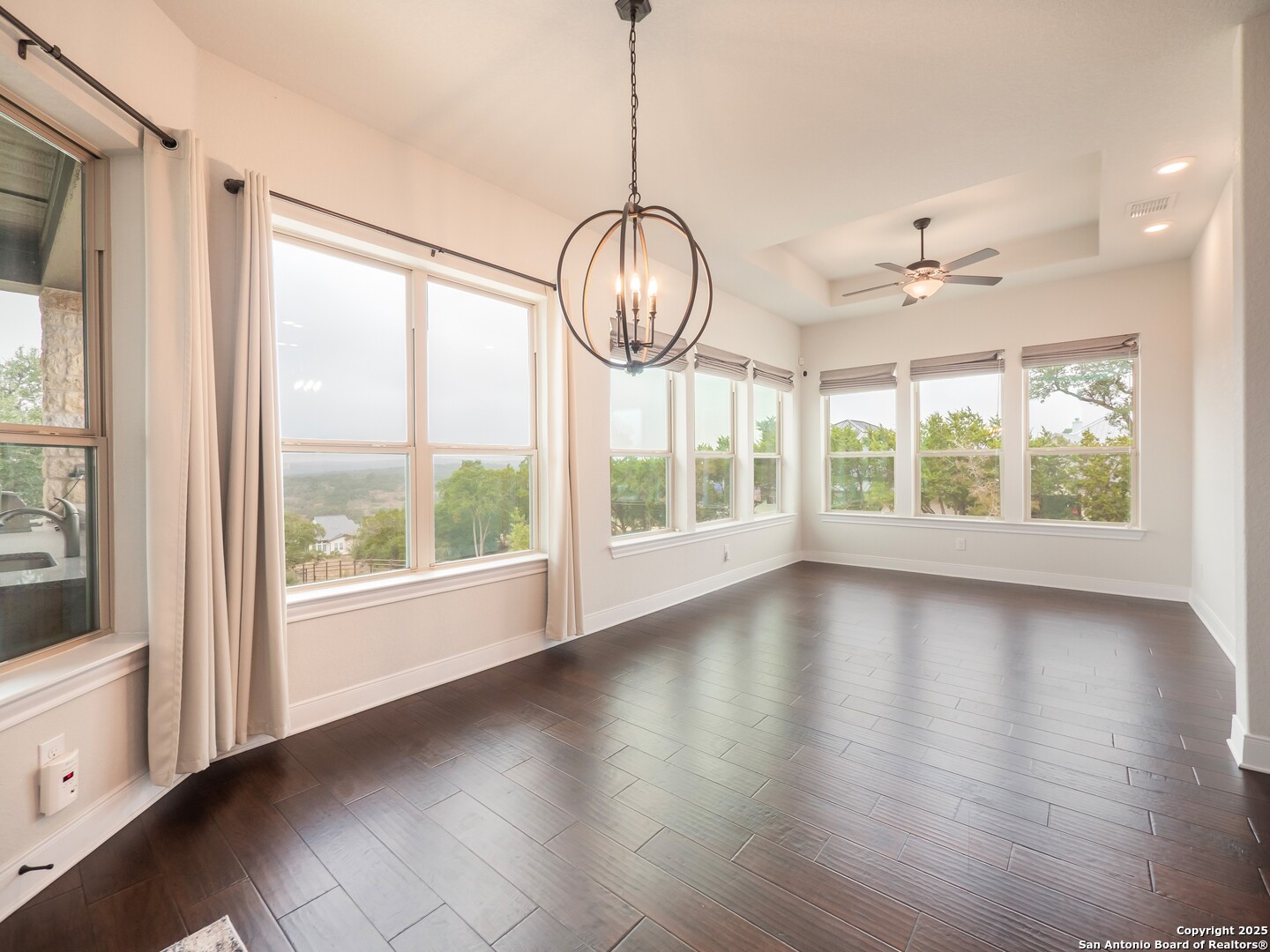 632 Carson Ridge New Braunfels, TX 78132 - Photo 20 of 57 a view of an empty room with wooden floor and a window