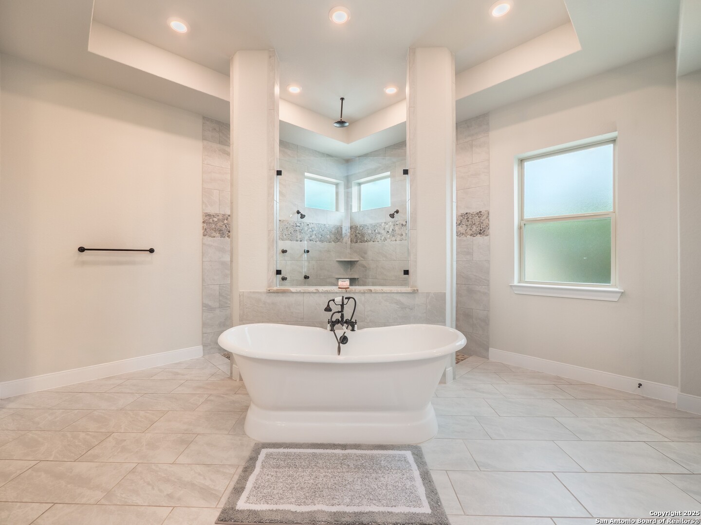 632 Carson Ridge New Braunfels, TX 78132 - Photo 24 of 57 a bathroom with a sink a mirror and a shower