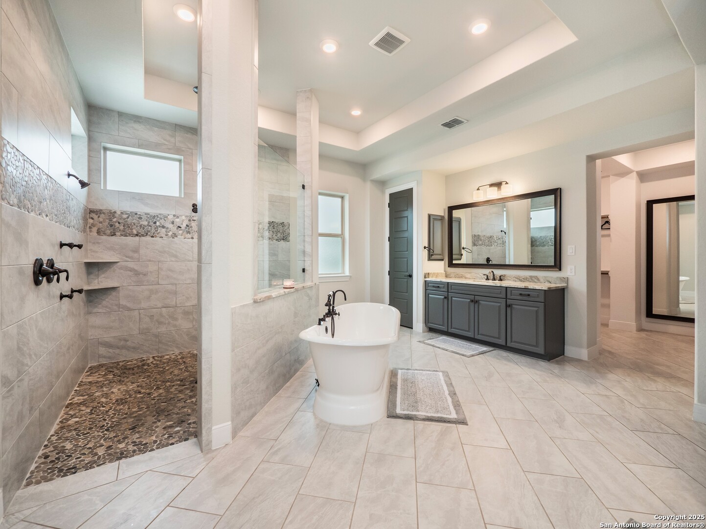 632 Carson Ridge New Braunfels, TX 78132 - Photo 26 of 57 a bathroom with a sink mirror and a shower