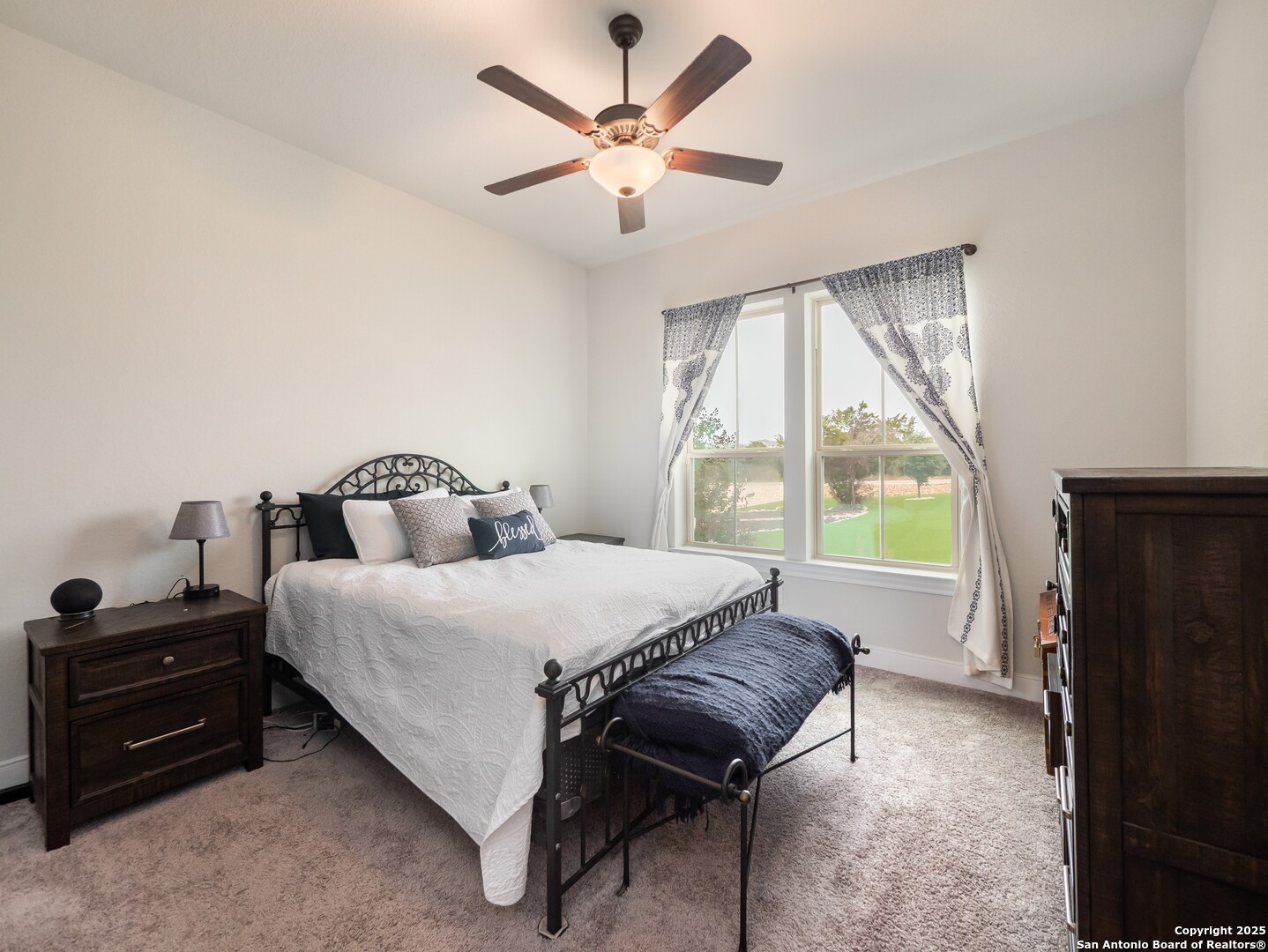 632 Carson Ridge New Braunfels, TX 78132 - Photo 31 of 57 a spacious bedroom with a bed and a tv