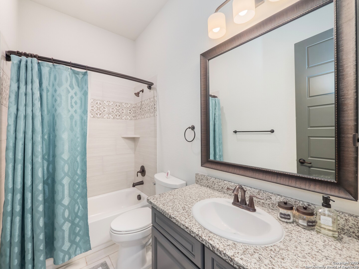 632 Carson Ridge New Braunfels, TX 78132 - Photo 32 of 57 a bathroom with a granite countertop sink toilet and shower