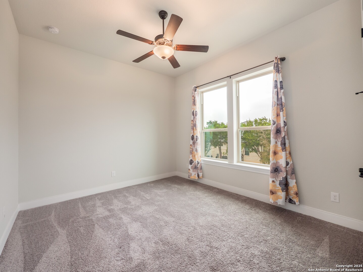 632 Carson Ridge New Braunfels, TX 78132 - Photo 33 of 57 an empty room with windows and fan