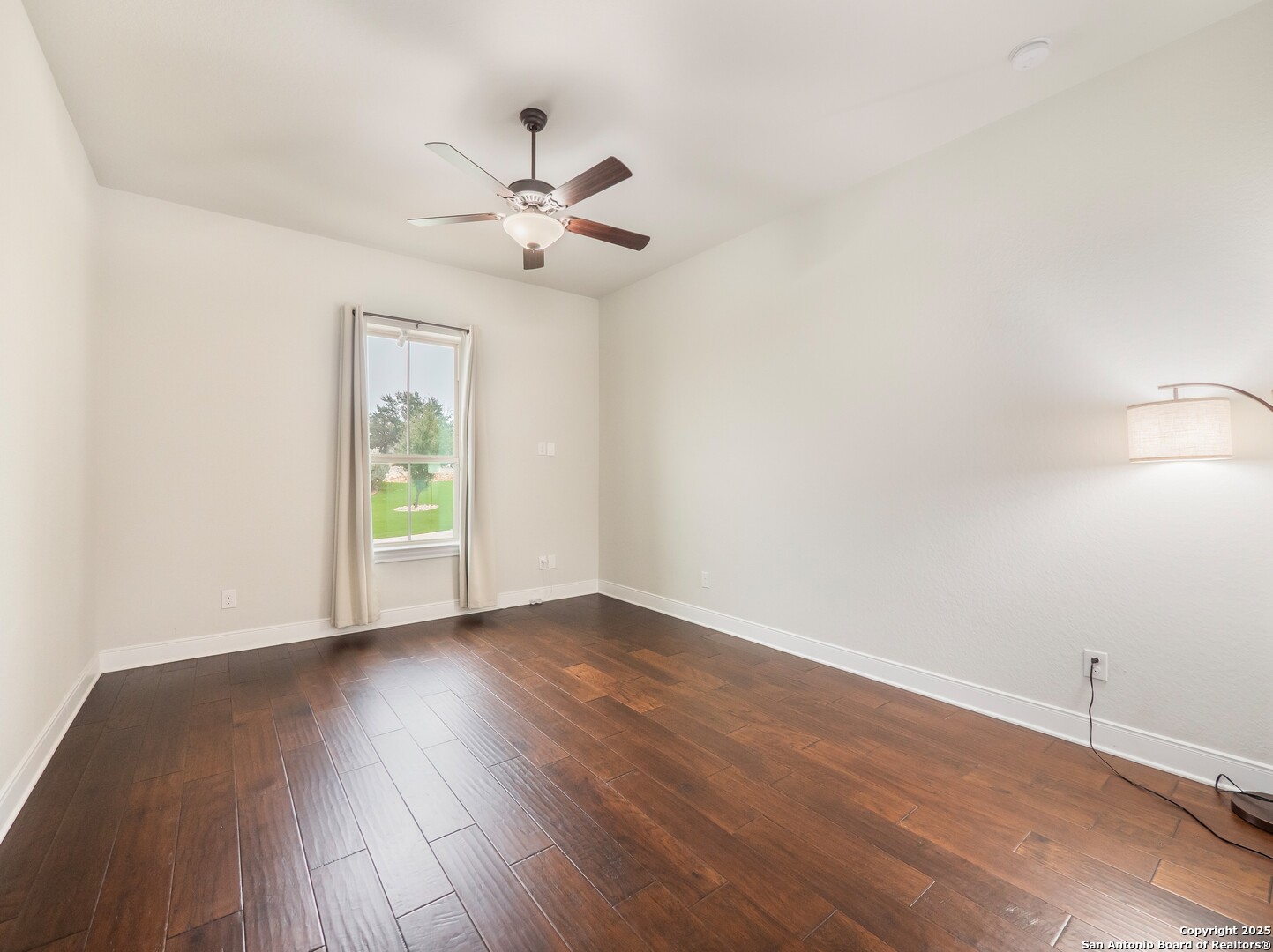 632 Carson Ridge New Braunfels, TX 78132 - Photo 34 of 57 an empty room with wooden floor fan and windows