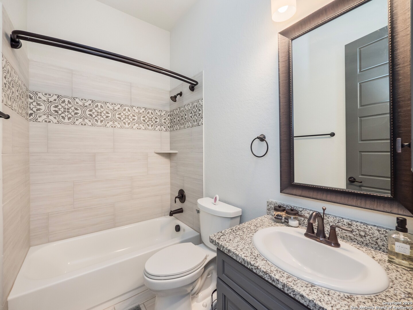 632 Carson Ridge New Braunfels, TX 78132 - Photo 35 of 57 a bathroom with a granite countertop sink a toilet and shower