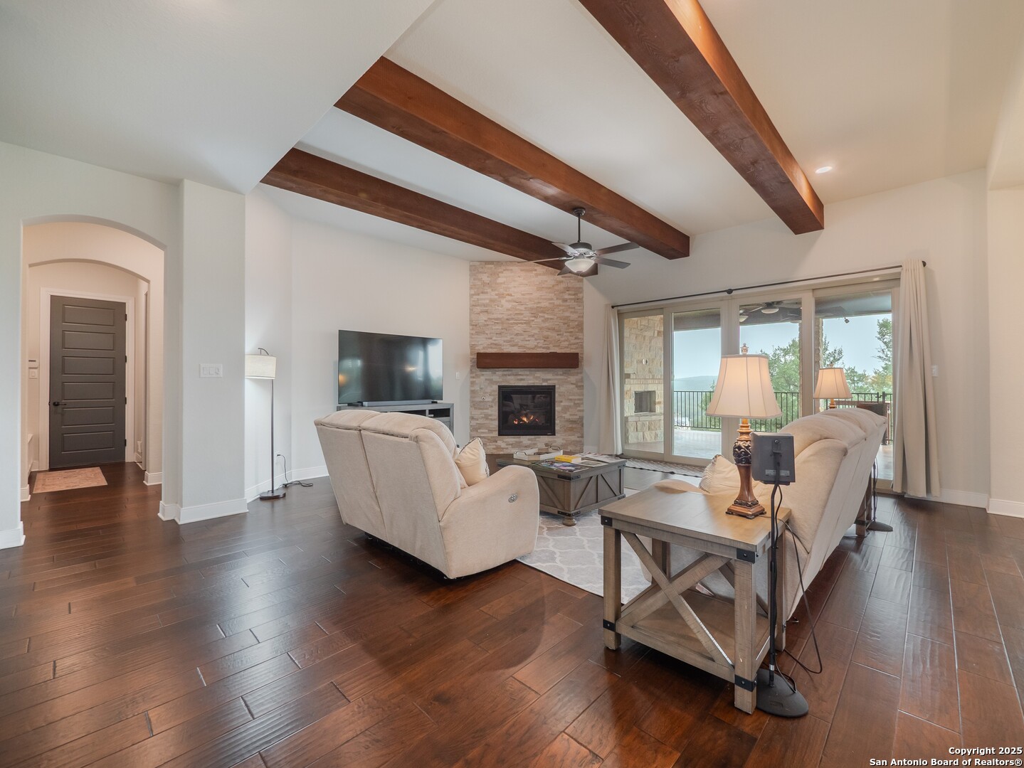 632 Carson Ridge New Braunfels, TX 78132 - Photo 10 of 57 a living room with fireplace furniture and a wooden floor