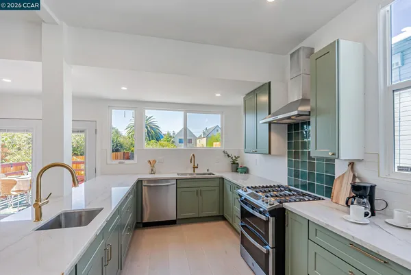 a view of a kitchen with a sink and a stove top oven