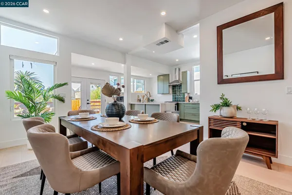 a dining room with furniture and window