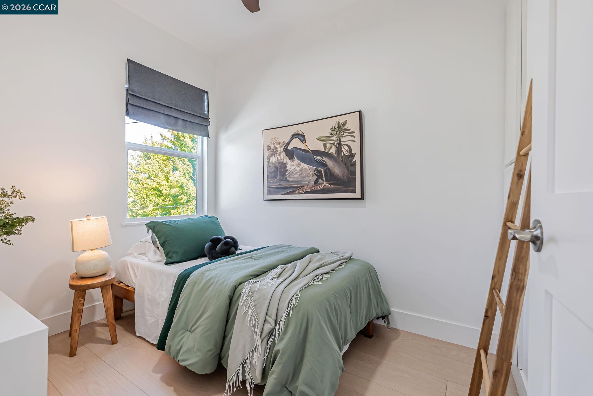 1727 9th Street Oakland, CA 94607 - Photo 17 of 36 a bedroom with bed and a window