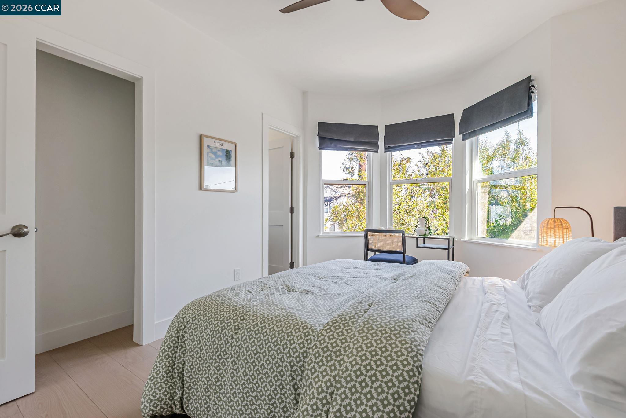 1727 9th Street Oakland, CA 94607 - Photo 22 of 36 a bedroom with a large bed and a large window