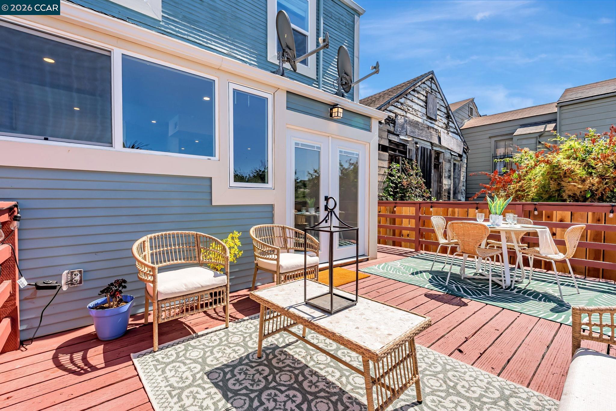 1727 9th Street Oakland, CA 94607 - Photo 29 of 36 a backyard of a house with barbeque oven table and chairs