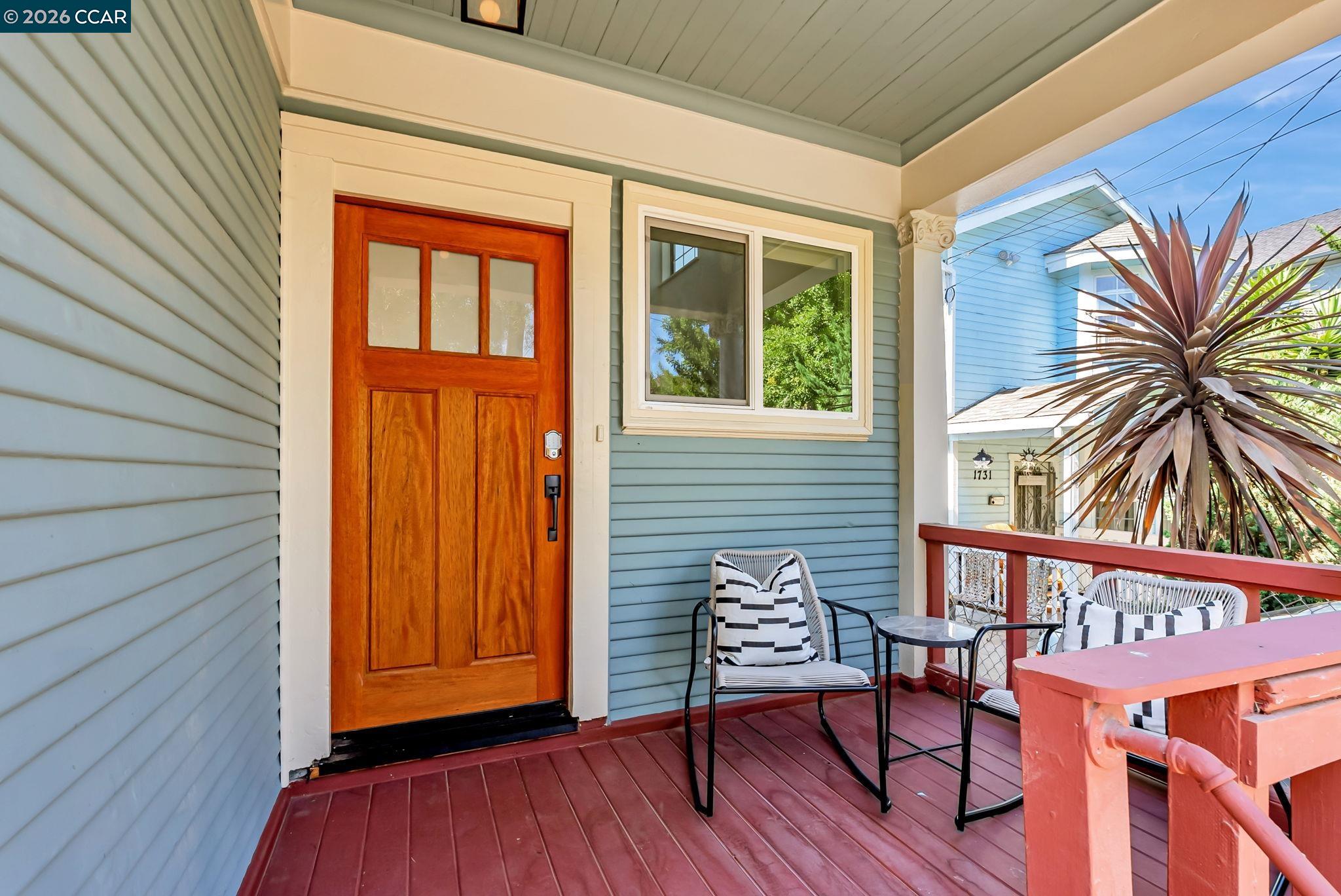 1727 9th Street Oakland, CA 94607 - Photo 3 of 36 a view of a lounge chairs in the porch