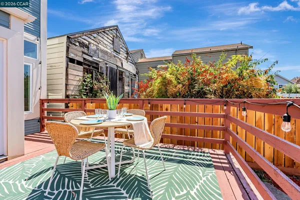 a front view of a house with a yard table and chairs