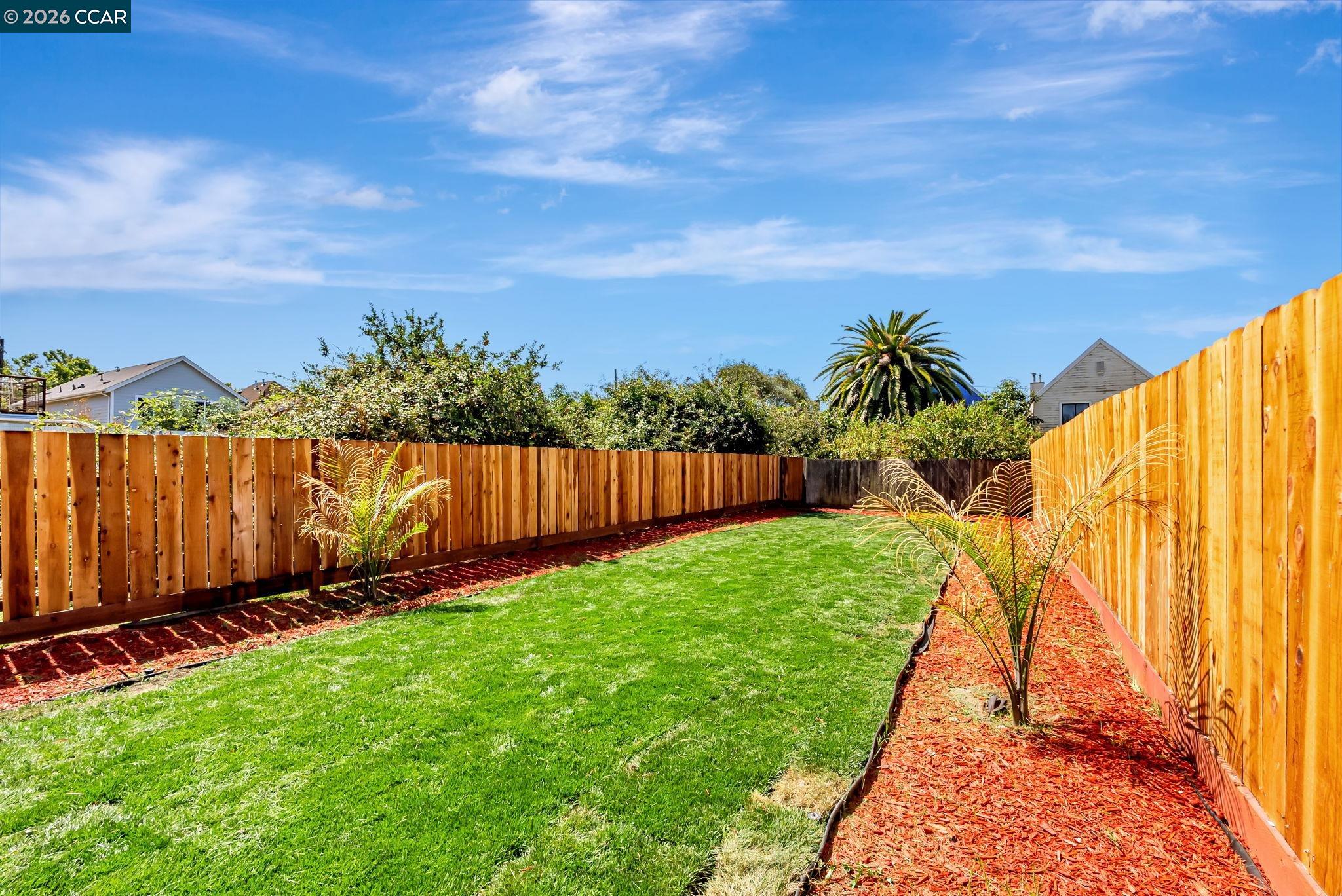 1727 9th Street Oakland, CA 94607 - Photo 33 of 36 a view of a backyard with wooden fence