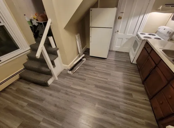 a view of an entryway with wooden floor