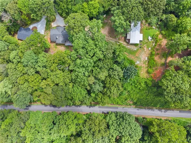 a view of a big yard with lots of green space