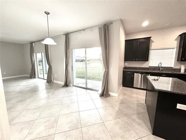 a view of a kitchen with a sink and a window