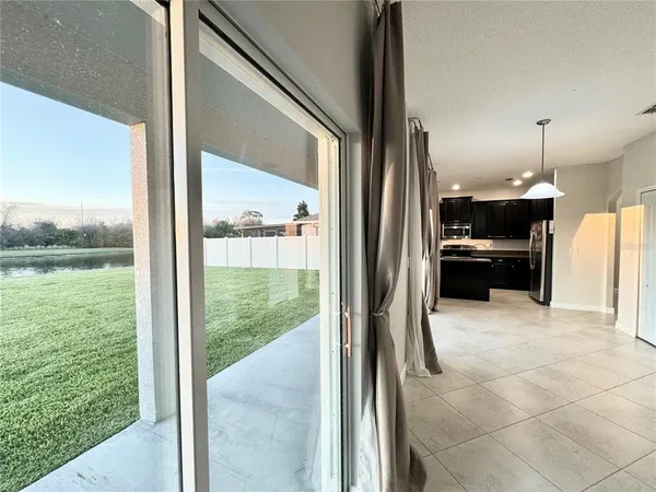 a view of a living room and floor to ceiling window