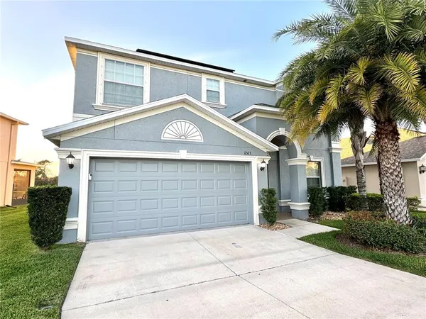 a front view of a house with a garage