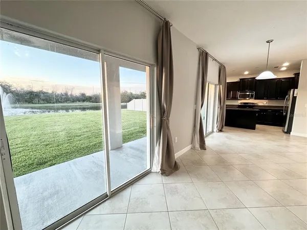 a view of living room and floor to ceiling window