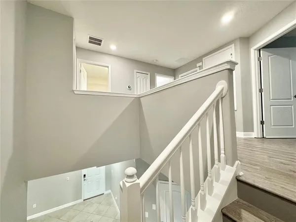 a view of entryway with wooden floor