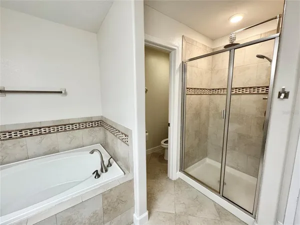 a bathroom with a bathtub and a shower