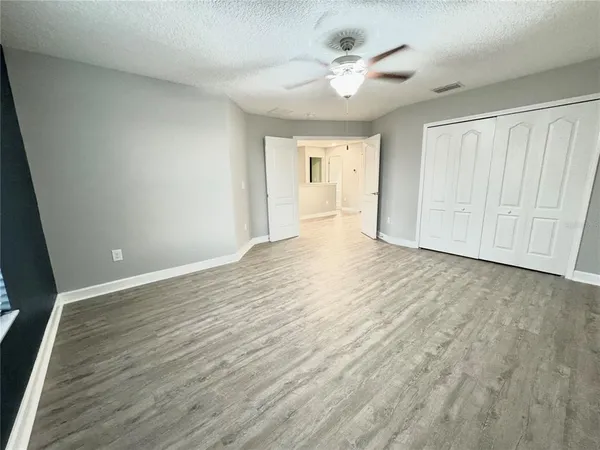 a view of an empty room with a window