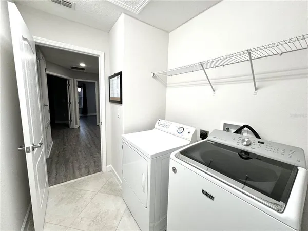 a utility room with dryer and washer