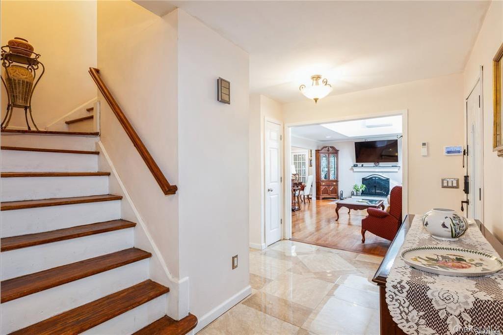 77 Duck Pond Road Glen Cove, NY 11542 - Photo 12 of 35 a view of a livingroom with furniture and staircase