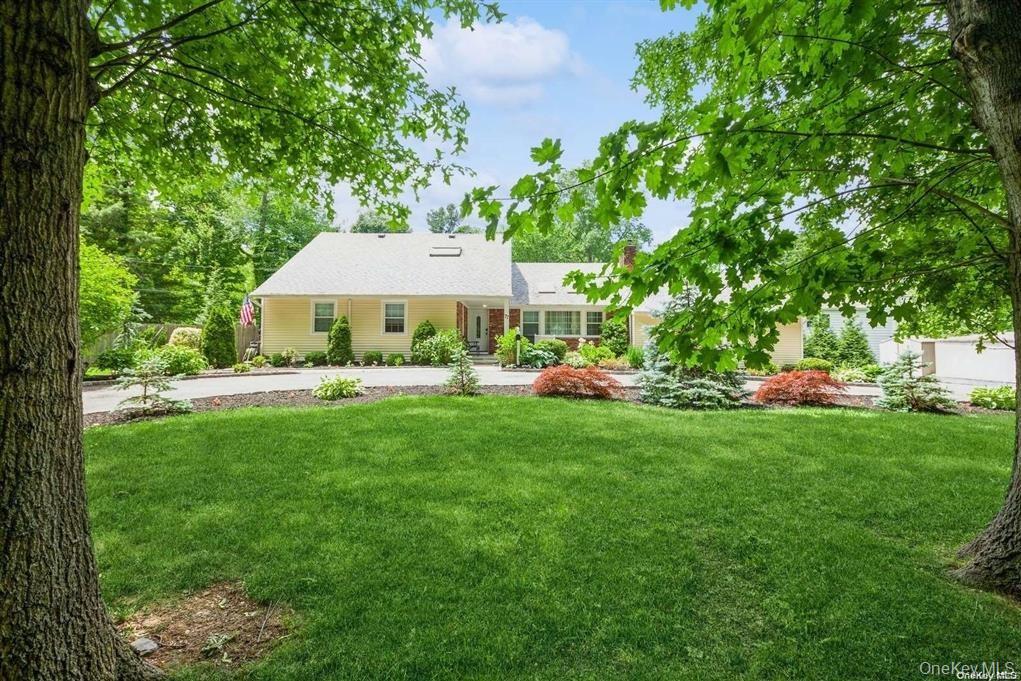 77 Duck Pond Road Glen Cove, NY 11542 - Photo 2 of 35 a view of an house with backyard space and garden