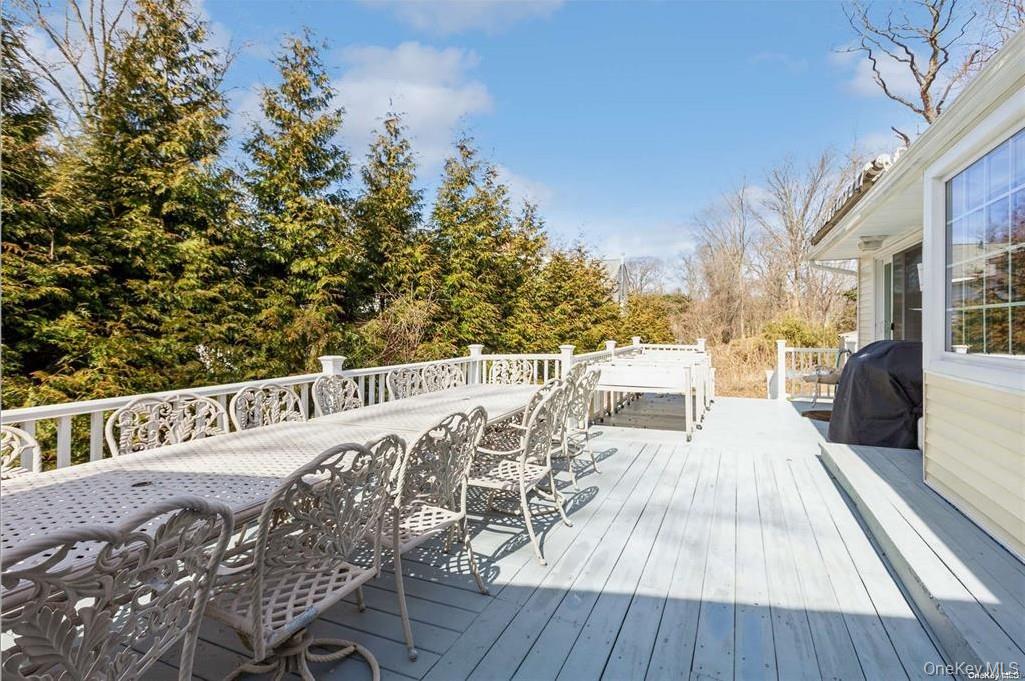 77 Duck Pond Road Glen Cove, NY 11542 - Photo 28 of 35 a balcony with wooden floor and furniture