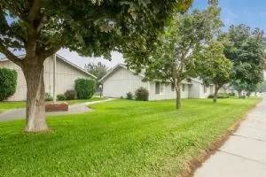 a front view of house with yard and green space