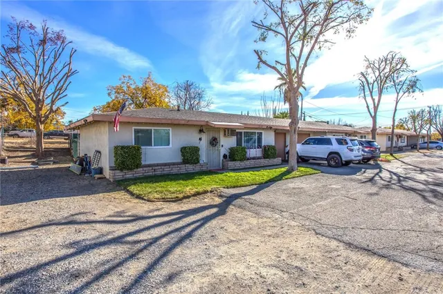 a view of house with outdoor space and swimming pool