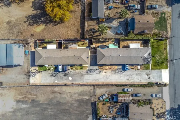 an aerial view of residential houses with outdoor space