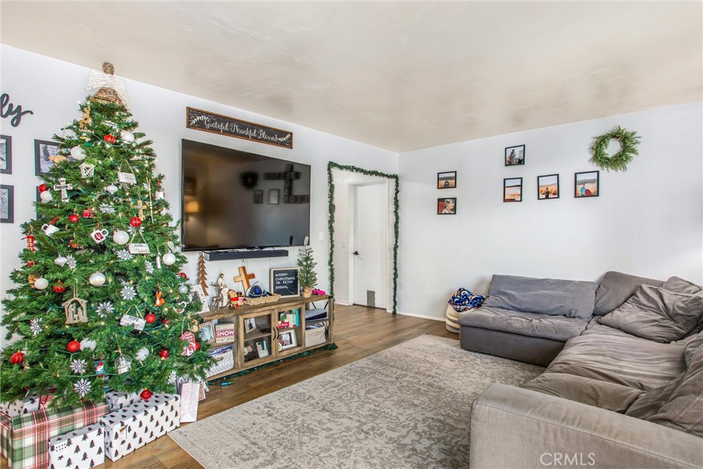 32390 Ave D Yucaipa, CA 92399 - Photo 35 of 44 a living room with furniture and a flat screen tv