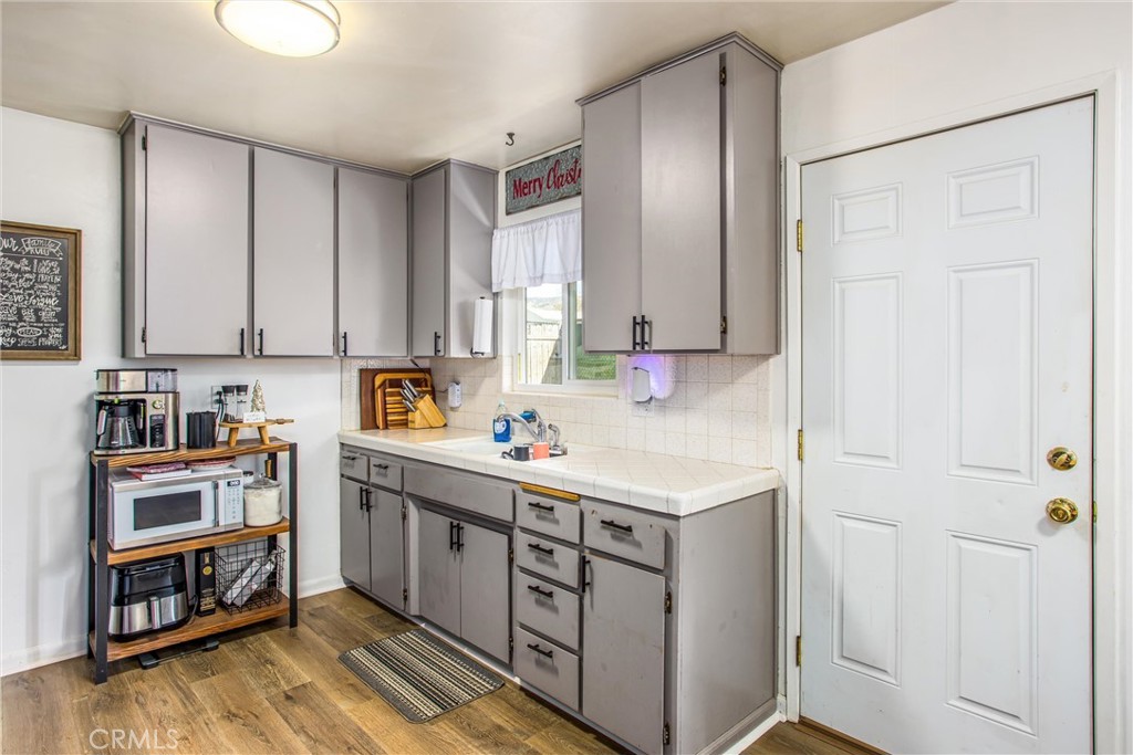 32390 Ave D Yucaipa, CA 92399 - Photo 37 of 44 a kitchen with a sink a stove and cabinets