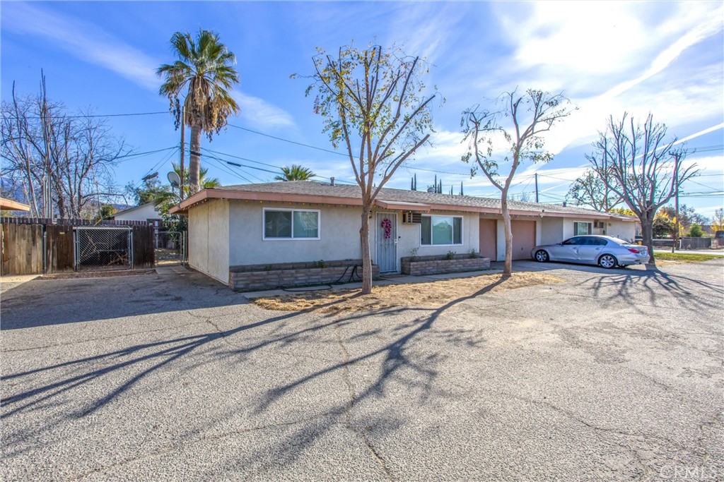 32390 Ave D Yucaipa, CA 92399 - Photo 8 of 44 a front view of a house with a yard and garage