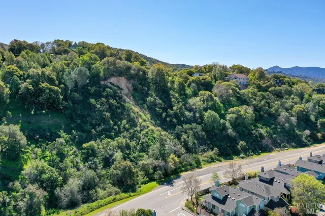 an aerial view of a house with mountain view