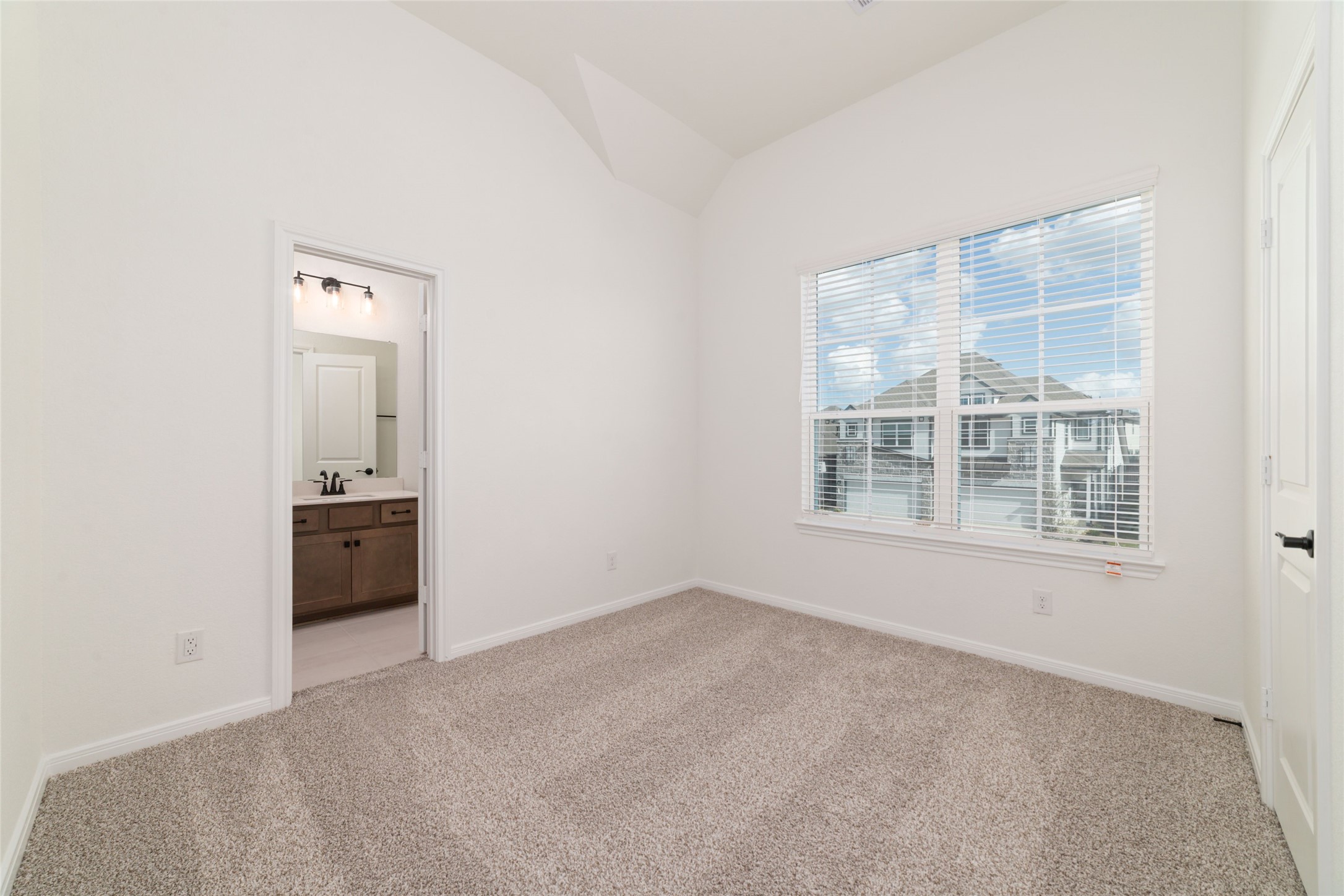 135 East Coralburst Loop, Unit 1 Montgomery, TX 77316 - Photo 21 of 22 an empty room with windows and cabinet