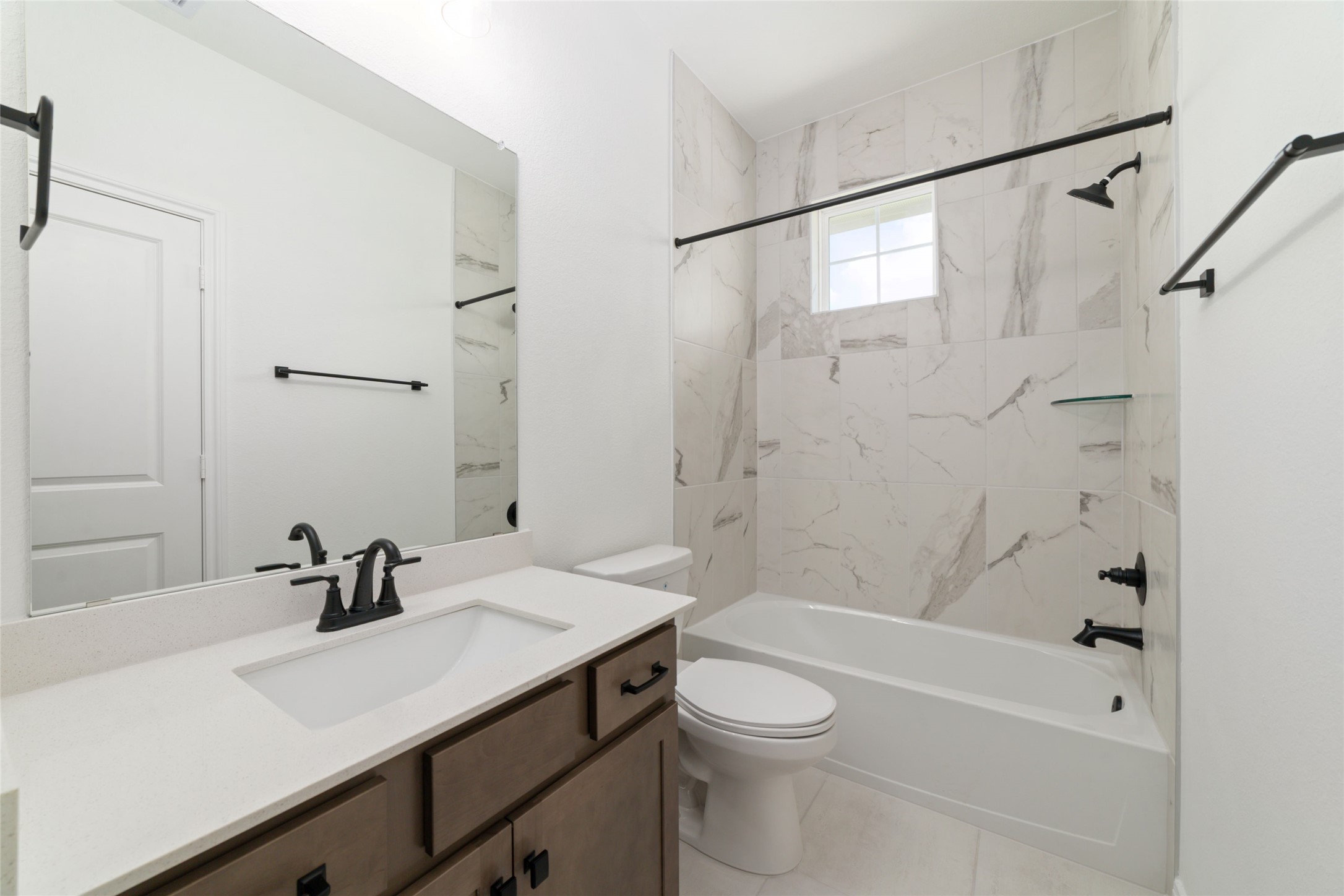 135 East Coralburst Loop, Unit 1 Montgomery, TX 77316 - Photo 22 of 22 a bathroom with a sink a toilet and shower