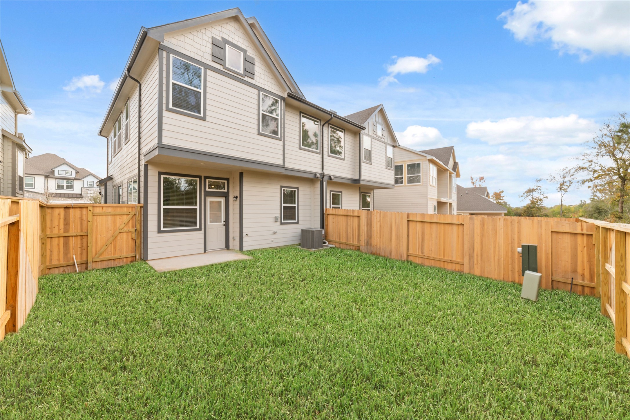 135 East Coralburst Loop, Unit 1 Montgomery, TX 77316 - Photo 3 of 22 a front view of a house with a yard